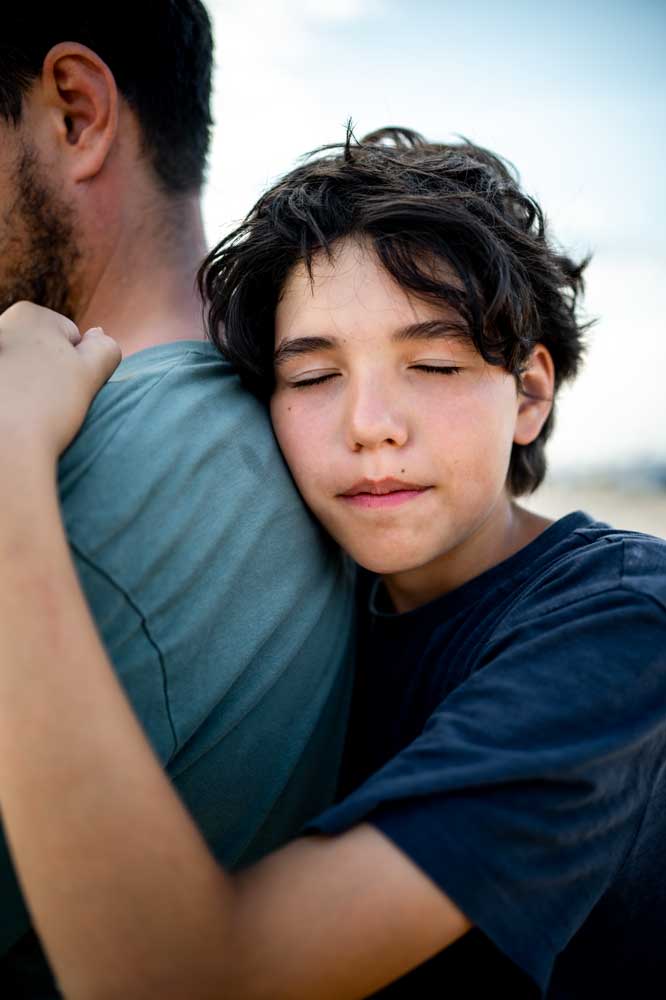 the-teenage-boy-snuggles-with-tenderness